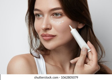 Eye Skin Care. Beautiful Woman Applying Eye Cream On Skin Under Eyes. High Quality