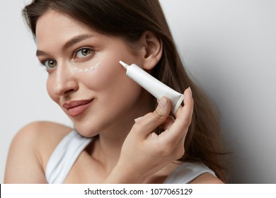 Eye Skin Care. Beautiful Woman Applying Eye Cream On Skin Under Eyes. High Quality