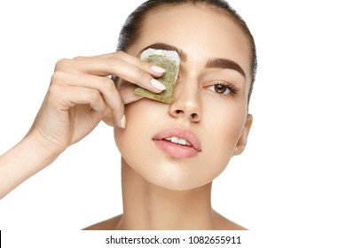 Eye Skin Care. Beautiful Woman With Green Tea Bag Under Eyes