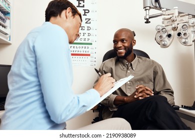 Eye test, exam or screening with an optometrist, optician or ophthalmologists with an ophthalmoscope, testing vision and eyesight. Man getting tested for prescription glasses or contact lenses - Powered by Shutterstock