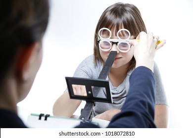 Eye Vision Therapy. Child With Prism Flippers. 