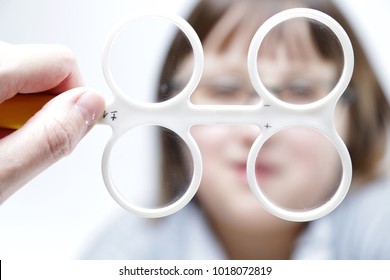 Eye Vision Therapy. Child With Prism Flippers. 