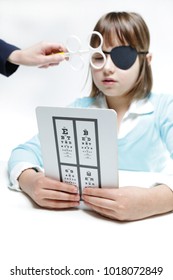 Eye Vision Therapy. Child With Prism Flippers. 