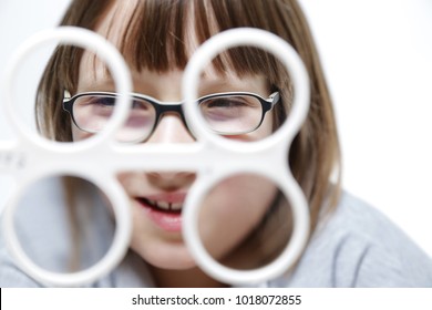 Eye Vision Therapy. Child With Prism Flippers. 