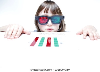 Eye Vision Therapy. Child With Red Green Reading Bar And Glasses