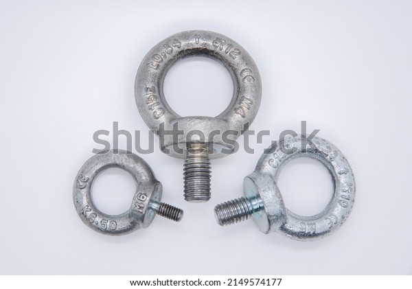 Eyebolt for lifting. Lifting bolt for\
lifting work. Various measures, isolated on\
white.