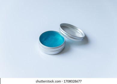 Eyebrow Gel. Brow Make Up Product In A Round Glass Package With Plastic Cap On White Background.