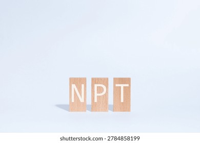 Eye-catching image of NPT text on wood blocks. The word stands for Non-Proliferation Treaty.