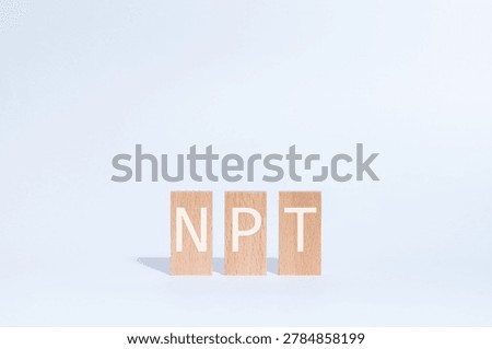 Eye-catching image of NPT text on wood blocks. The word stands for Non-Proliferation Treaty.