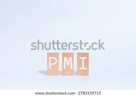 Eye-catching image of PMI text on wood blocks. The word stands for Post Merger Integration.