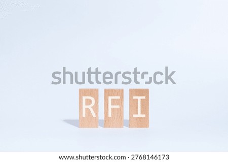 Eye-catching image of RFI text on wood blocks. The word stands for Request For Information.