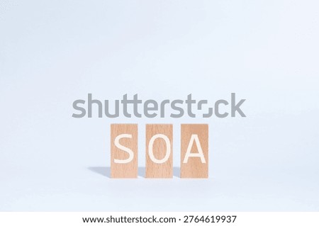 Eye-catching image of SOA text on wood blocks. The word stands for Service Oriented Architecture.