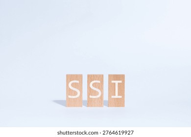 Eye-catching image of SSI text on wood blocks. The word stands for Self Sovereign Identity.