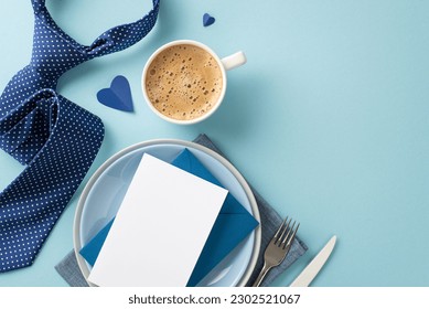 Eye-catching table setting concept for Father's Day with top view flat lay of plates, napkin, cutlery, envelope with paper sheet, tie, coffee on a pastel blue background with space for text or message