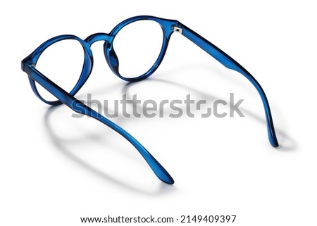 Eyeglasses in blue bright color in transparent plastic. Eyewear rear view with shadow. Trendy glasses isolated on white background. Fashion spectacles for man and woman