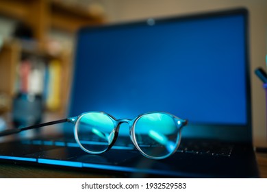 Eyeglasses with blue light filter can protect your eyes from screens. - Shutterstock ID 1932529583