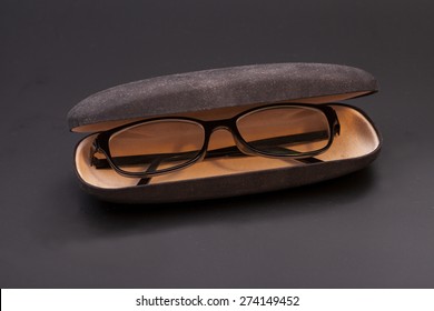 Eyeglasses and eyeglasses case in a black background