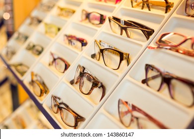 Eyeglasses, shades and sunglasses in optician's shop