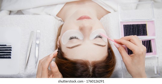 Eyelash Extension Procedure. Woman Master Combs Lashes Fake.