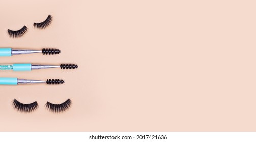 Eyelashes And Lash Brushes On Light Brown Background. Trendy Background For Lash Artist. 