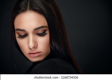 Eyelashes Makeup. Woman Beauty Face With Black Lashes Extensions
