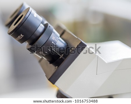 Eyepieces or oculars mounted on a movable head or turret of a compound light microscope. This instrument can be found in many laboratories and is useful both for research and teaching purposes.