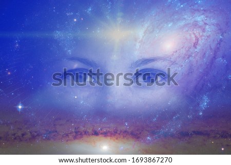 the eyes of a clairvoyant in space against the background of the starry sky and galaxies. The concept of clairvoyance, esotericism or astrology. Elements of this image furnished by NASA