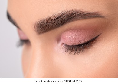 Eyes and eyebrows close up. Portrait of a beautiful teenage girl with beautiful makeup and healthy clean skin.Makeup and cosmetology concept.