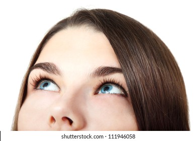 Eyes Looking Up. Beautiful Happy Teen Girl Looking Up Isolated Over White
