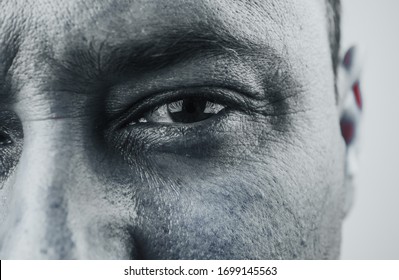 eyes, man staring and focus on camera. close-up with bristles on a gray background. male eyes close-up.