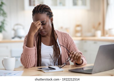 Eyes Strain. Overworked Black Freelancer Woman Tired After Using Laptop In Kitchen While Working Remotely On Computer At Home Office, Upset African American Lady Rubbing Nose Bridge, Free Space