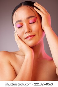 Eyeshadow  asian   beauty woman and hands face pose and pink   orange cosmetics  Funky  trendy   colorful fashion makeup model for Gen Z cosmetic style grey studio background 