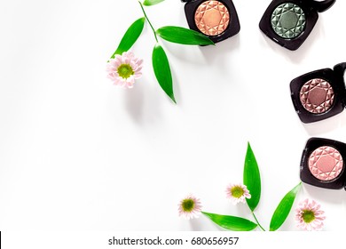 Eyeshadow on white table background top view copyspace