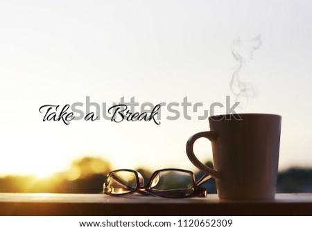 A eyewear glasses and mug with sunset background. Wording 