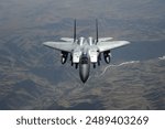 An F-15E flies watch over the skies of Afghanistan July 30. The F-15 and crew are deployed to Bagram Air Field, Afghanistan, from Mountain Home Air Force Base, Idaho. 