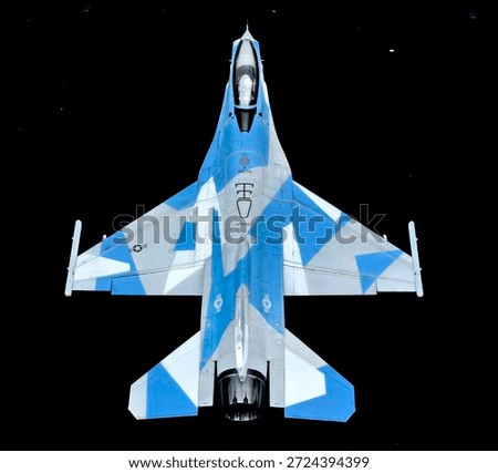 F-16C Aggressor model in splinter camouflage color pattern on blackground.