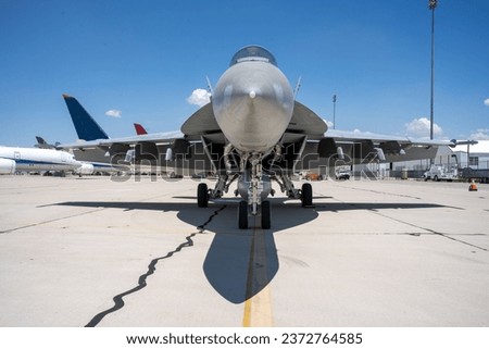 F-18 fighter jet parked at an airfield.