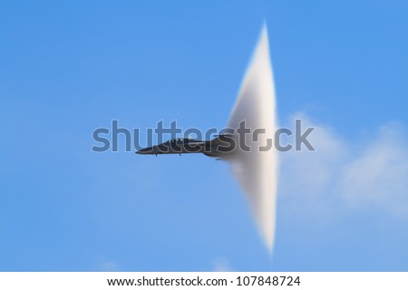 F-18 Super Hornet Vapor Cone - A distinctive vapor cone forms around the jet as it nears the speed of sound, otherwise known as the Prandtl-Glauert Singularity.