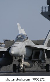 An F/A-18F Super Hornet Awaits Catapult Assisted Launch From A Nuclear Aircraft Carrier