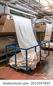 Fabric batching process machine industrial plant line in a textile factory.