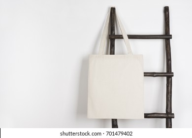 Fabric Cloth Shopping Bag Mockup Hanging On Vintage Wooden Stepladder