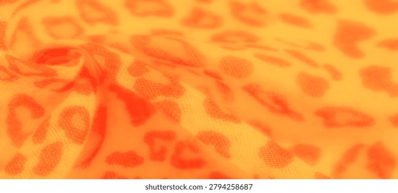 of the fabric create a visually pleasing blend of orange and yellow tones, forming a checkered design.