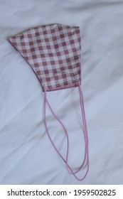 Fabric Face Mask With Cotton Fabric Pink White Pleated Pattern. For Cover Mouth And Protection With Sewing Fashion