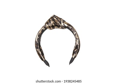 Fabric Headband With A Knot And Beige And Brown Leopard Print. The Hair Holder Is Isolated On The White Background