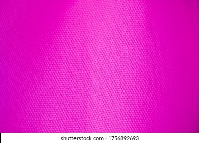 Fabric Pattern Pink. Sport Clothing Fabric Texture Background. Top View Of Cloth Textile Surface. Pink Football Shirt. Text Space, Close Up.