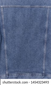 Fabric Pattern Texture Of Denim Or Back Blue Jeans Jacket With Seam
