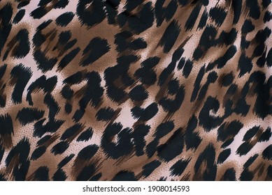 Fabric With A Print Of The Skin Of A Cheetah, Leopard, Wild Predators. A Woman In Clothes Made Of Such Fabric Feels Strong, Bold And A Little Wild. Top View