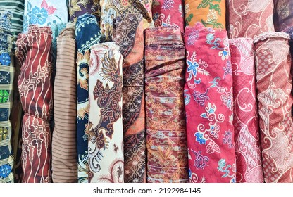Fabric Rolls Of Colorful Indonesian Batik In The Textile Shop