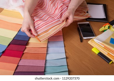 Fabric samples on table, selection of colour