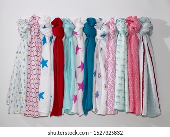 Fabric Scarves Hanging On White Background